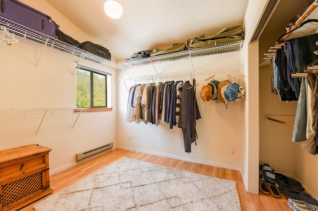 23 Cooper Rd, Cedar Crest, NM 87008 - spacious closet featuring a baseboard heating unit and wood finished floors