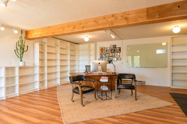 23 Cooper Rd, Cedar Crest, NM 87008 - sitting room featuring rail lighting, wood finished floors, a textured ceiling, a desk, and beamed ceiling