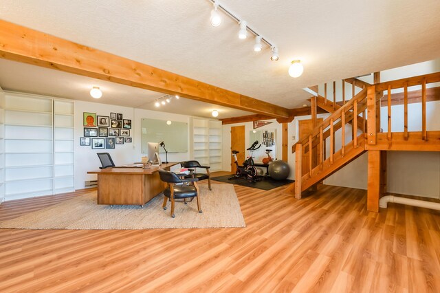 23 Cooper Rd, Cedar Crest, NM 87008 - office featuring light wood-style floors, track lighting, beamed ceiling, a baseboard heating unit, and built in features