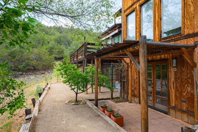 23 Cooper Rd, Cedar Crest, NM 87008 - view of patio / terrace with french doors and a forest view