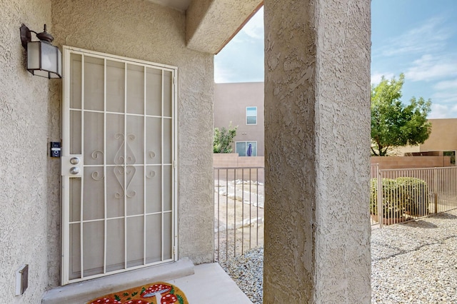 2353 Cortina Loop SE, Rio Rancho, NM 87124 - entrance to property featuring stucco siding