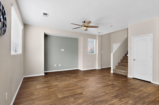 2353 Cortina Loop SE, Rio Rancho, NM 87124 - empty room with a ceiling fan, wood finished floors, stairway, and a textured ceiling