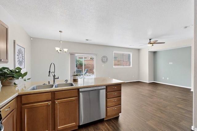 2353 Cortina Loop SE, Rio Rancho, NM 87124 - kitchen with stainless steel dishwasher, brown cabinetry, dark wood-style floors, a peninsula, and ceiling fan