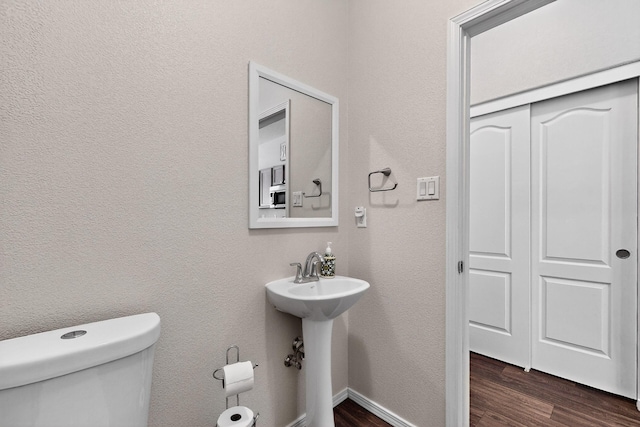 2353 Cortina Loop SE, Rio Rancho, NM 87124 - bathroom featuring toilet and wood finished floors