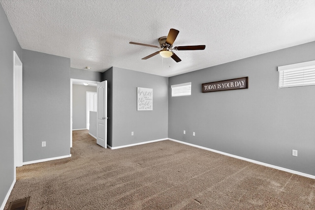 2353 Cortina Loop SE, Rio Rancho, NM 87124 - carpeted empty room with a ceiling fan and a textured ceiling