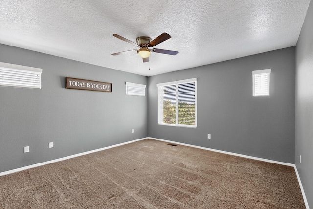 2353 Cortina Loop SE, Rio Rancho, NM 87124 - spare room with a ceiling fan, carpet flooring, and a textured ceiling