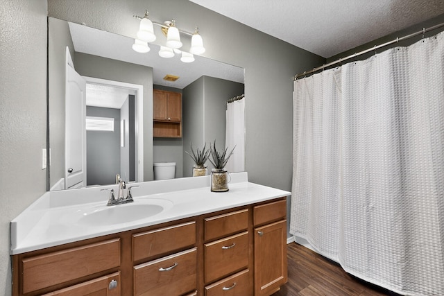 2353 Cortina Loop SE, Rio Rancho, NM 87124 - full bath featuring wood finished floors, vanity, a textured ceiling, and a shower with shower curtain