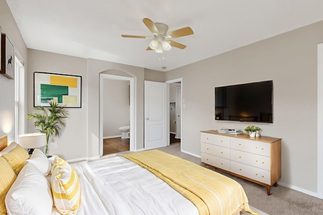 2353 Cortina Loop SE, Rio Rancho, NM 87124 - bedroom featuring arched walkways, light carpet, ensuite bathroom, and ceiling fan