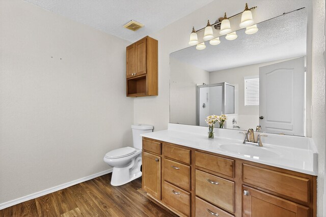 2353 Cortina Loop SE, Rio Rancho, NM 87124 - bathroom featuring vanity, a shower stall, and wood finished floors