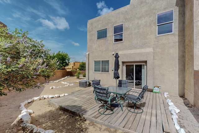 2353 Cortina Loop SE, Rio Rancho, NM 87124 - deck featuring a fenced backyard and outdoor dining area