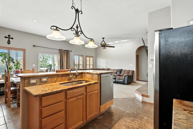 8500 Clarks Fork Rd NW, Albuquerque, NM 87120 - kitchen with appliances with stainless steel finishes, open floor plan, a ceiling fan, dark colored carpet, and hanging light fixtures