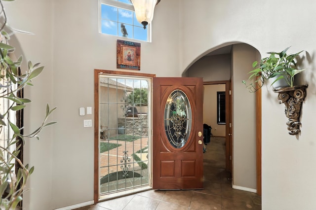 8500 Clarks Fork Rd NW, Albuquerque, NM 87120 - foyer entrance featuring arched walkways, tile patterned floors, and a high ceiling