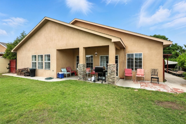 8500 Clarks Fork Rd NW, Albuquerque, NM 87120 - back of property with stucco siding, a patio area, and a yard