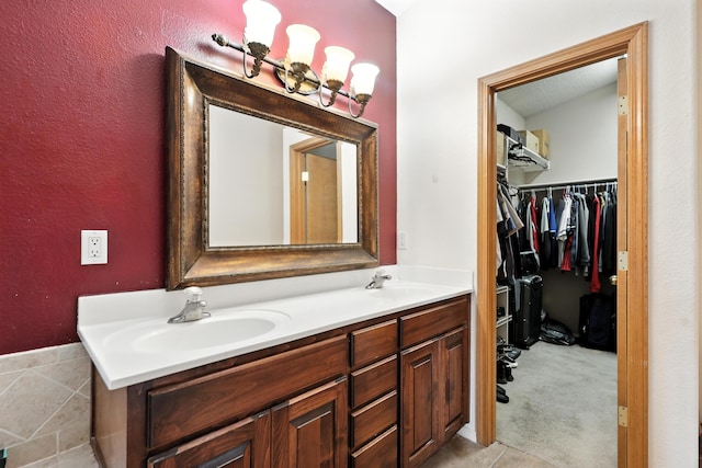 8500 Clarks Fork Rd NW, Albuquerque, NM 87120 - bathroom with double vanity and a spacious closet