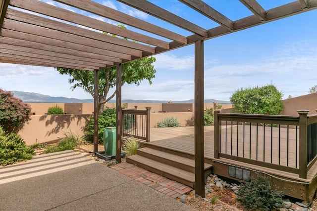 31 Wind Rd NW, Albuquerque, NM 87120 - wooden terrace with a mountain view and a pergola