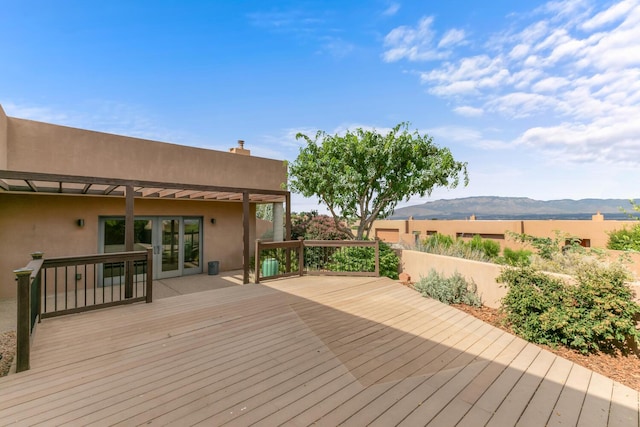 31 Wind Rd NW, Albuquerque, NM 87120 - wooden deck featuring a mountain view and french doors