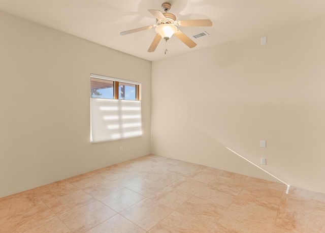 31 Wind Rd NW, Albuquerque, NM 87120 - unfurnished room with a ceiling fan and light tile patterned flooring