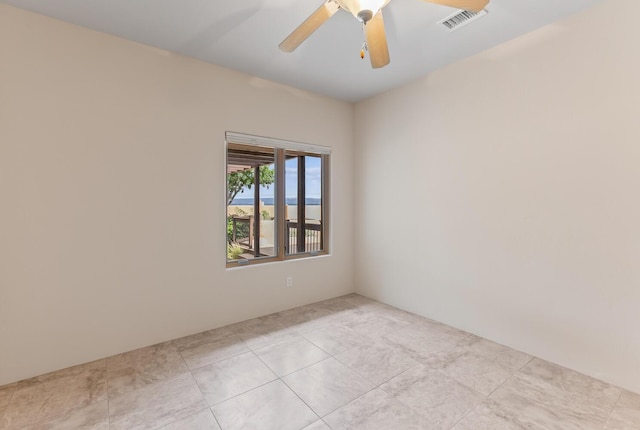 31 Wind Rd NW, Albuquerque, NM 87120 - empty room featuring a ceiling fan and light tile patterned floors