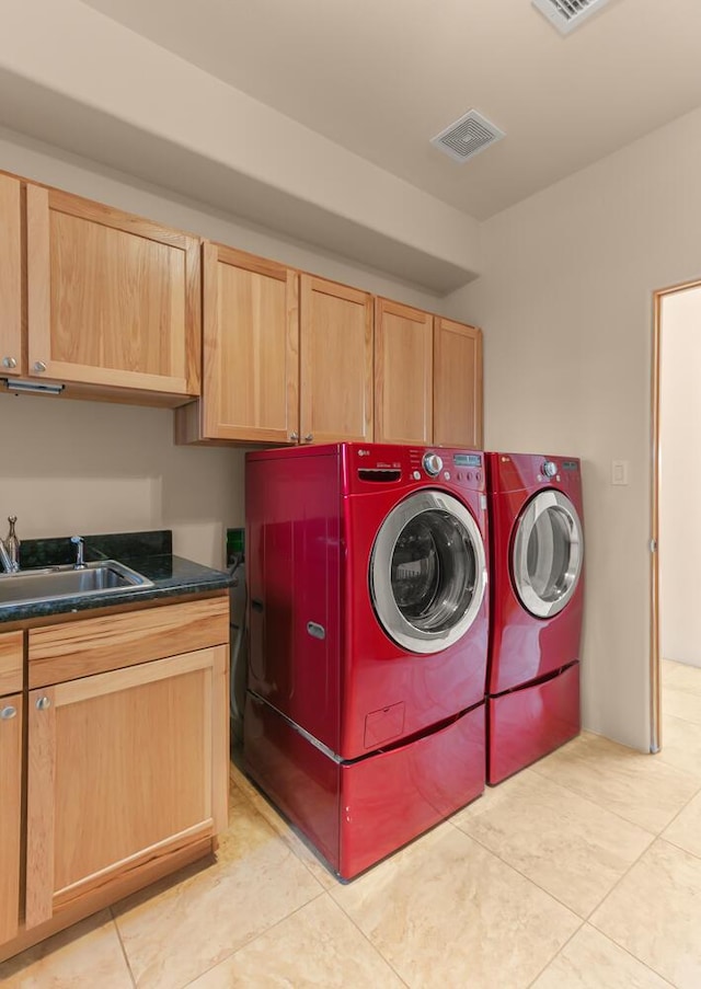 31 Wind Rd NW, Albuquerque, NM 87120 - laundry area featuring cabinet space, light tile patterned floors, and washing machine and clothes dryer