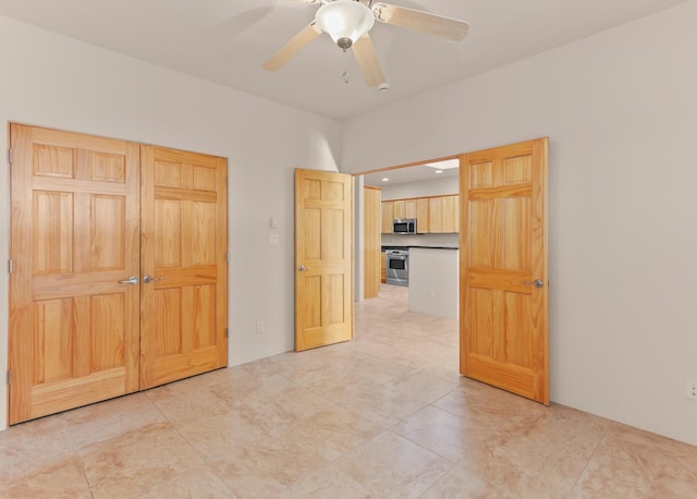 31 Wind Rd NW, Albuquerque, NM 87120 - spare room featuring ceiling fan