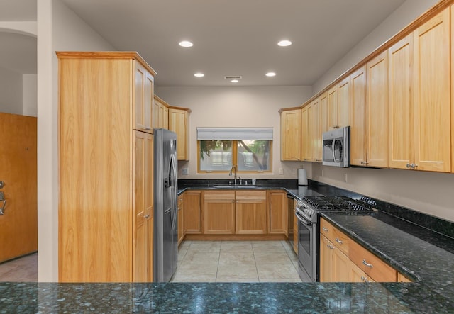 31 Wind Rd NW, Albuquerque, NM 87120 - kitchen featuring stainless steel appliances, recessed lighting, dark stone countertops, light tile patterned flooring, and light brown cabinets