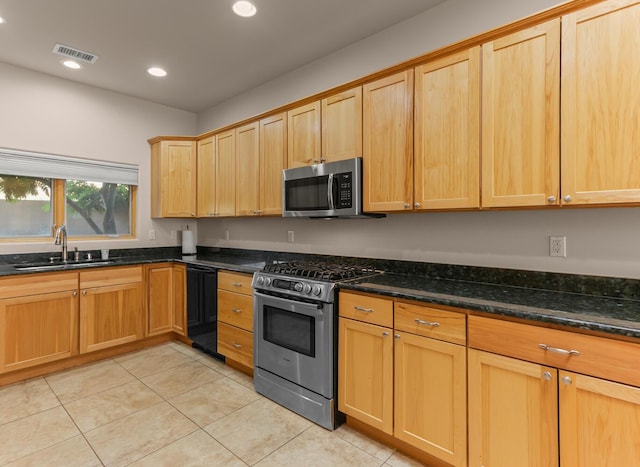31 Wind Rd NW, Albuquerque, NM 87120 - kitchen with stainless steel appliances, light tile patterned flooring, dark stone counters, and recessed lighting