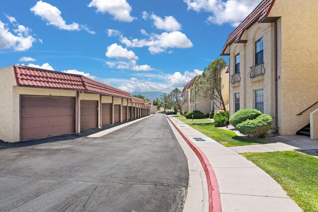 805 Country Club Dr SE Unit G2, Rio Rancho, NM 87124 - view of asphalt road with community garages and a residential view