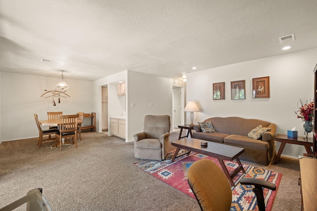 805 Country Club Dr SE Unit G2, Rio Rancho, NM 87124 - living area featuring light colored carpet, a textured ceiling, and recessed lighting