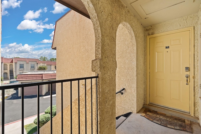 805 Country Club Dr SE Unit G2, Rio Rancho, NM 87124 - property entrance featuring stucco siding and a balcony