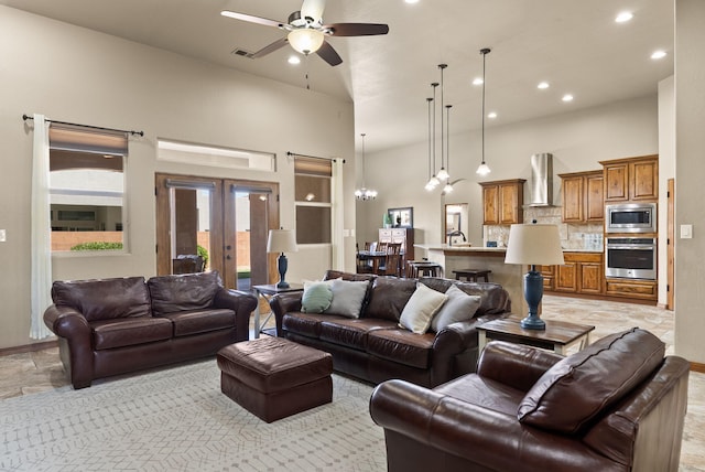 9844 Cameron St NW, Albuquerque, NM 87114 - living room featuring a high ceiling, recessed lighting, ceiling fan, french doors, and a chandelier