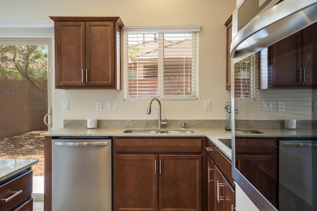 827 Purple Aster Dr, Bernalillo, NM 87004 - kitchen with stainless steel dishwasher and light stone countertops