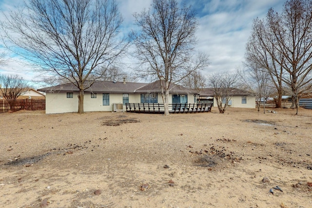 6 Shady Ln, Los Lunas, NM 87031 - rear view of property with stucco siding and a wooden deck