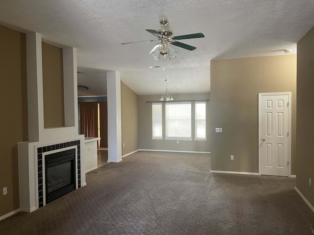 45 Juniper Ave, Los Lunas, NM 87031 - unfurnished living room with ceiling fan, carpet flooring, a tiled fireplace, and a textured ceiling