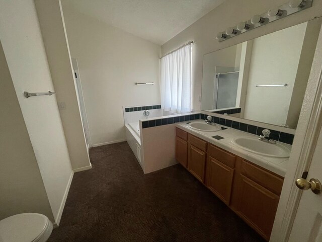 45 Juniper Ave, Los Lunas, NM 87031 - full bathroom featuring double vanity, a garden tub, an enclosed shower, and vaulted ceiling