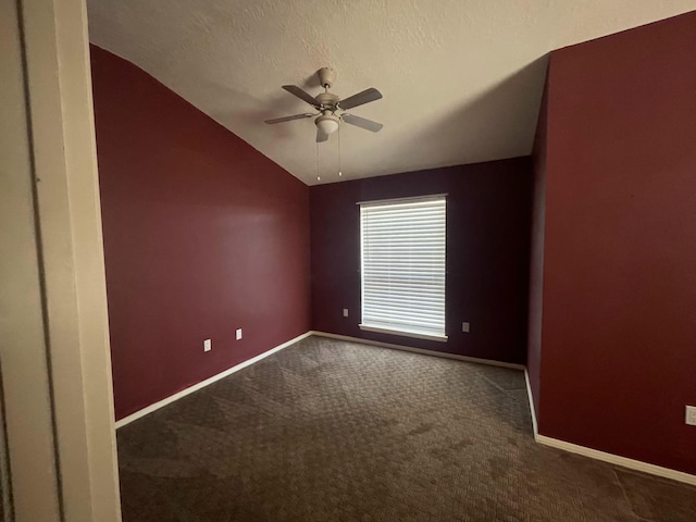 45 Juniper Ave, Los Lunas, NM 87031 - unfurnished room featuring lofted ceiling, dark carpet, and ceiling fan