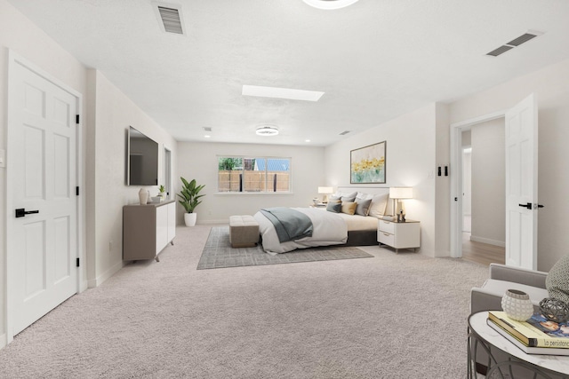 697 W W Meadowlark Ln, Corrales, NM 87048 - bedroom featuring a skylight and light colored carpet