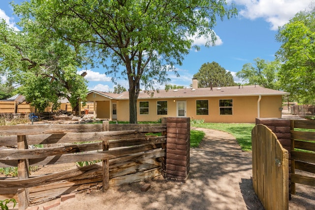 697 W W Meadowlark Ln, Corrales, NM 87048 - view of front of home with stucco siding