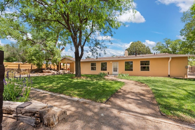 697 W W Meadowlark Ln, Corrales, NM 87048 - view of front of property with stucco siding and a chimney