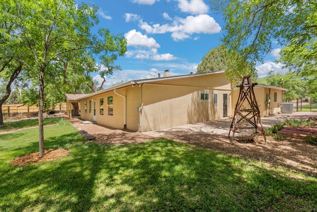 697 W W Meadowlark Ln, Corrales, NM 87048 - rear view of house with stucco siding and an attached carport