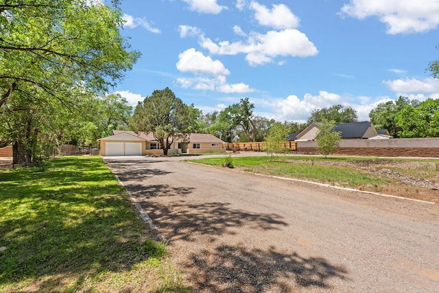 697 W W Meadowlark Ln, Corrales, NM 87048 - view of front of property with driveway and a garage