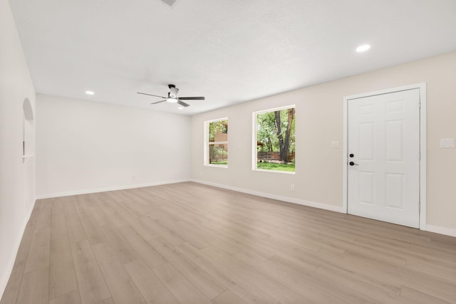 697 W W Meadowlark Ln, Corrales, NM 87048 - unfurnished living room featuring ceiling fan, light wood-style flooring, and recessed lighting
