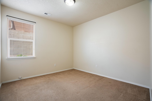 5485 Roosevelt Loop NE, Rio Rancho, NM 87144 - spare room with carpet and a textured ceiling