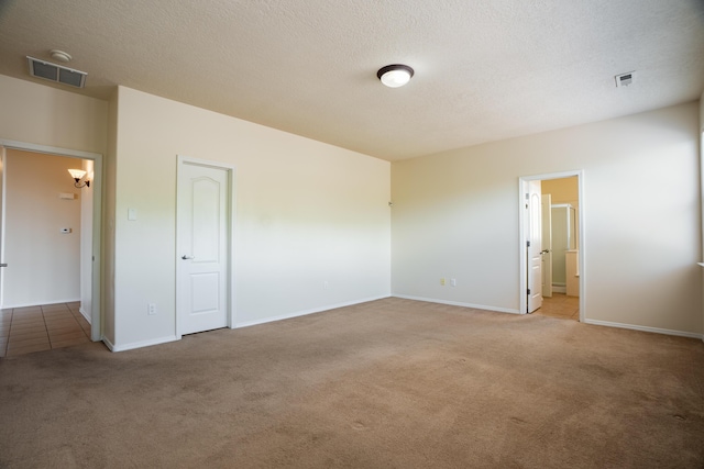 5485 Roosevelt Loop NE, Rio Rancho, NM 87144 - carpeted spare room with a textured ceiling and a chandelier