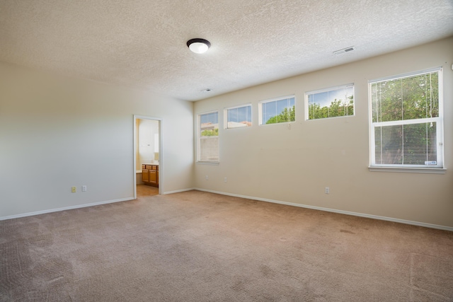 5485 Roosevelt Loop NE, Rio Rancho, NM 87144 - empty room with light carpet and a textured ceiling