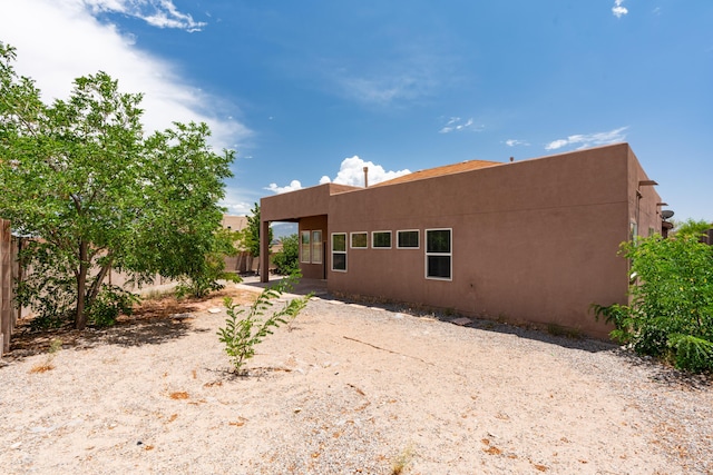 5485 Roosevelt Loop NE, Rio Rancho, NM 87144 - back of house featuring stucco siding
