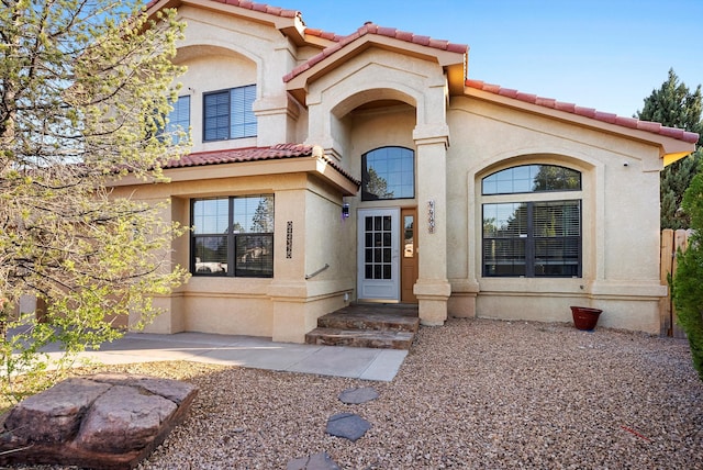 4432 La Paloma Rd NW, Albuquerque, NM 87120 - view of front of home featuring a tiled roof and stucco siding