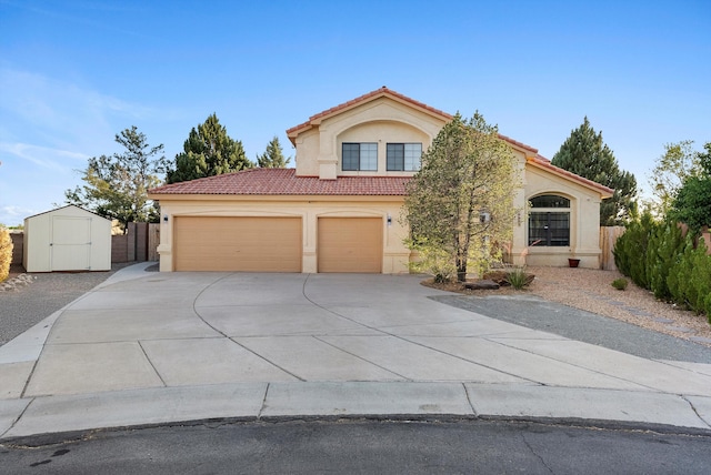 4432 La Paloma Rd NW, Albuquerque, NM 87120 - mediterranean / spanish house featuring stucco siding, a tiled roof, concrete driveway, a garage, and a shed