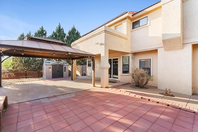 4432 La Paloma Rd NW, Albuquerque, NM 87120 - view of patio featuring a gazebo and a storage unit