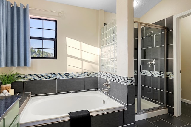 4432 La Paloma Rd NW, Albuquerque, NM 87120 - bathroom featuring a garden tub, a shower stall, and tile patterned flooring
