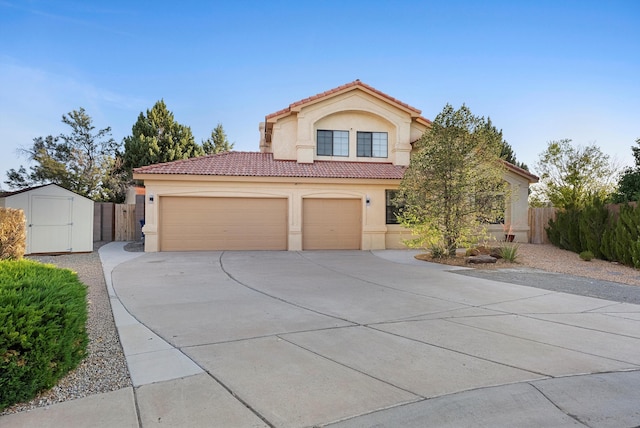 4432 La Paloma Rd NW, Albuquerque, NM 87120 - mediterranean / spanish home with stucco siding, a tiled roof, concrete driveway, a storage shed, and an attached garage